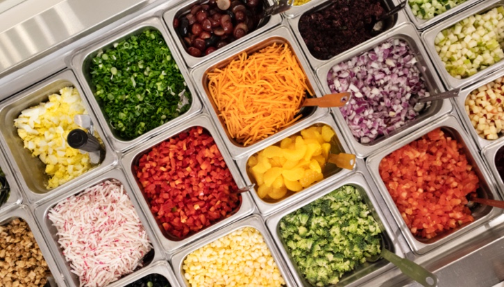 buffet of different types of food for salad bowl